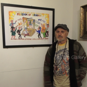 Toby Zoates with his painting, "Freedom to Discriminate"