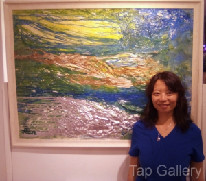 Artist with her work