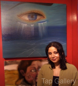 Artist with her work